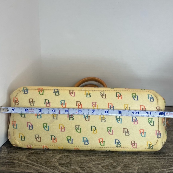 Dooney & Bourke Cream Satchel Bag pre-owned. Strap has stain. - Picture 9 of 16